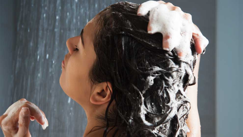 A person washing their hair