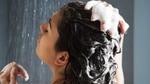 A person washing their hair